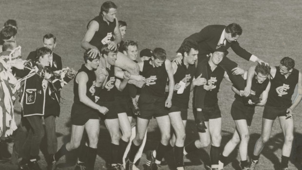 Jubilant Carlton players chair coach Ron Barassi and captain John Nicholls after winning the 1968 grand final.