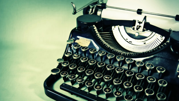 A typewriter is a machine that allows a person to print words directly onto paper without a computer.
