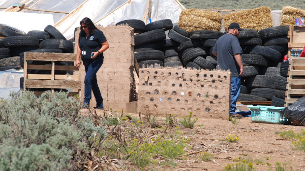 Searchers found the remains of a boy at the makeshift compound that was raided in search of a missing Georgia child. 