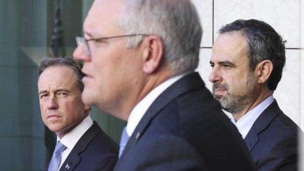 Health Minister Greg Hunt, Prime Minister Scott Morrison and president of the Australian Medical Association, Dr Omar Khorshid, at a COVID press conference in Canberra earlier this year. 