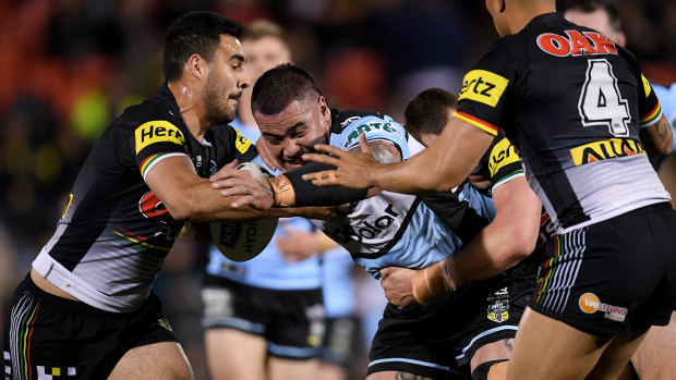 Heavy contact: Andrew Fifita is tackled by Tyrone May and Isaah Yeo.