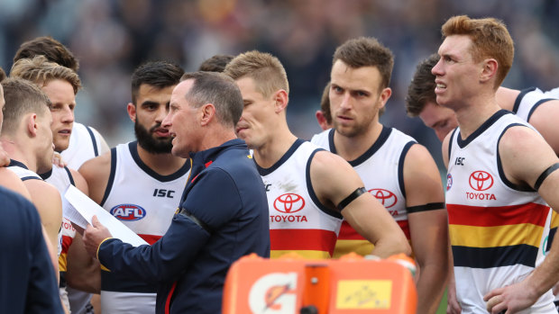 Selection misfires: Don Pyke talks with his players during the match against Carlton at the MCG on Saturday.