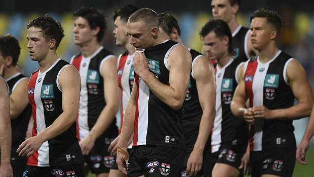 The Saints walk from the field after giving up a commanding lead against Adelaide.