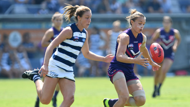 Madaleine McMahon of the Cats and Ebony Antonio of the Dockers in a contest.