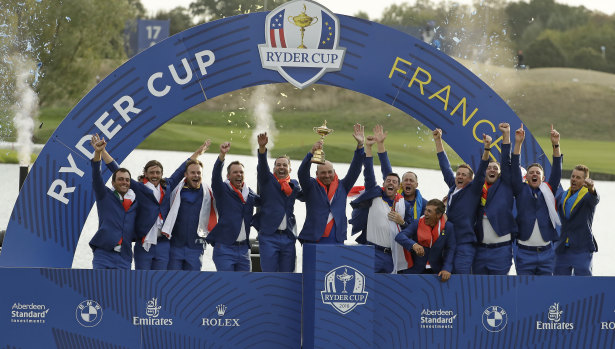Europe team captain Thomas Bjorn receives the Ryder Cup  trophy.