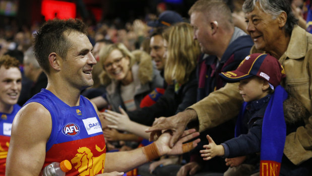 On for young and old: Luke Hodge greets Lions fans after the game at Marvel Stadium in Melbourne.