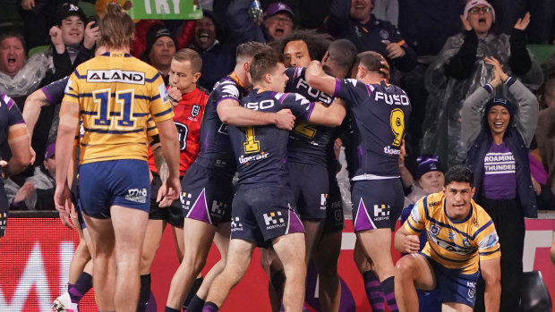 Never in the race: The Eels watch on as the Storm celebrate a try to Cameron Munster.
