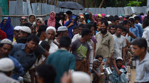 Rohingya refugees queue for a meal provided by a Turkish aid agency in the Shofiullah Kata camp, Cox’s Bazar, Bangladesh.
