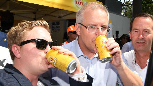 Just a regular bloke: Australian Prime Minister Scott Morrison has a beer with locals on the Sunshine Coast