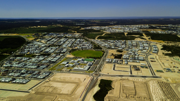 This drone shot shows Alkimos and its surrounds looking inland - the coastal strip where the north's growth will go. Wanneroo Road can just be seen in the top third, while state forest, national park and agricultural land can be seen beyond, illustrating the confines this expansion must be done within.