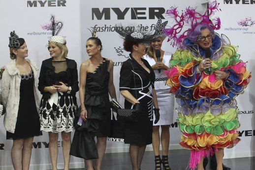 Dame Edna judges fashion at Flemington race track on Derby Day in 2010.