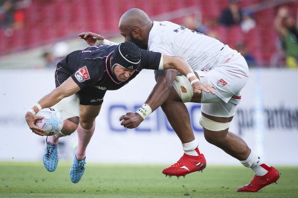 Matt Giteau is tackled by Apisai Naikatini of Old Glory DC in the MLR.