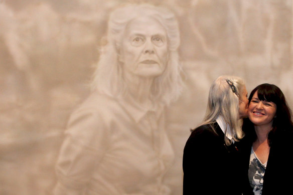 Winner of the 2014 Archibald Prize, Fiona Lowry with her subject, Penelope Seidler, at the Art Gallery of NSW.

