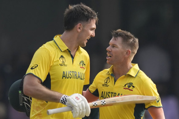 David Warner congratulates teammate Mitchell Marsh for scoring a century during the ICC Men’s Cricket World Cup match between Australia and Pakistan.