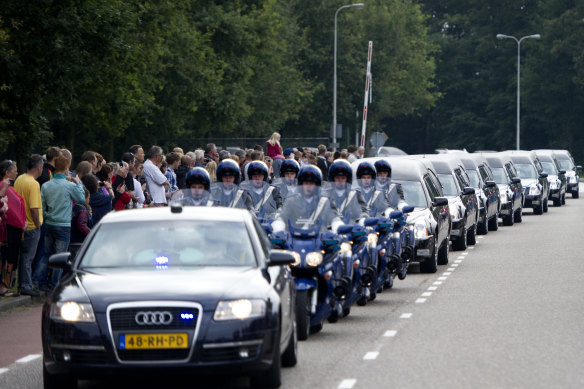 Hearses carry the bodies of the MH17 victims from Eindhoven Airbase to Hilversum on July 25, 2014.