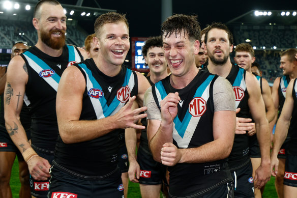 Dan Houston (left) celebrates a Port win with Zak Butters this season.