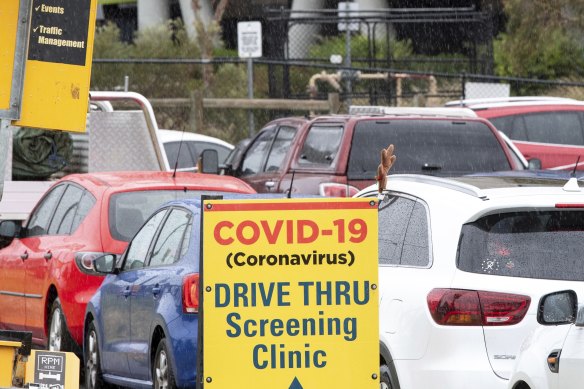 Drivers wait for COVID-19 testing in a long queue in their cars at the Central Bayside Community Health Services testing site.