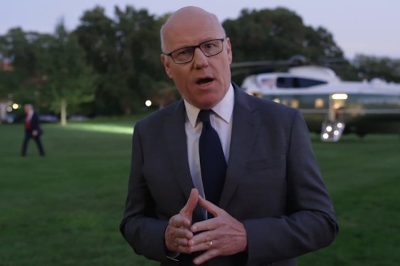 John Lyons pictured during his Four Corners investigation with Trump in the background.
