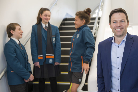 Preston High principal Sean Butler with year 7 students Marcus, Lili and Jasmine. 