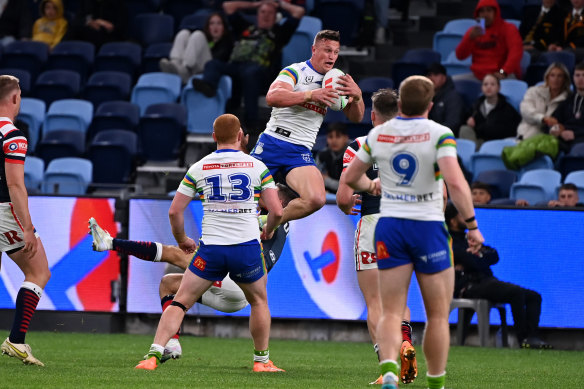 Jack Wighton outleaps James Tedesco for one of the Raiders’ first-half tries.