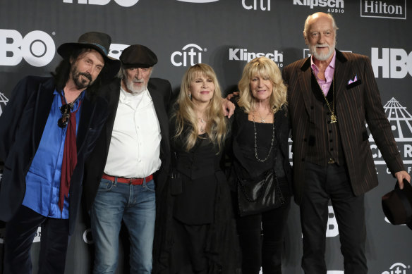 Christine McVie (second from right) with Fleetwood Mac, from left, Mike Campbell, John McVie, Stevie Nicks, and Mick Fleetwood in 2019.