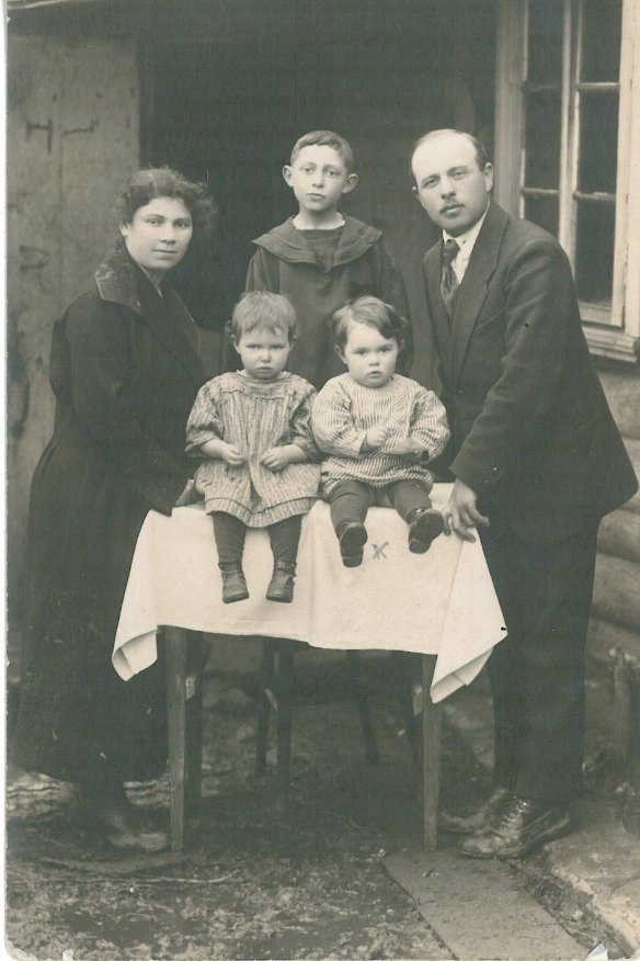 Phillip (sitting front left) with his family at his grandma’s house in the early 1920s. 