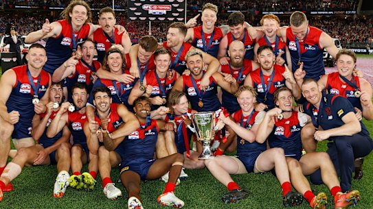 The Demons celebrate.