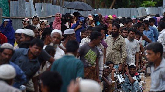 Rohingya refugees queue for a meal provided by a Turkish aid agency in the Shofiullah Kata camp, Cox’s Bazar, Bangladesh.