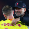Juergen Klopp and Jordan Henderson celebrate Liverpool’s 2-1 win over Southampton.