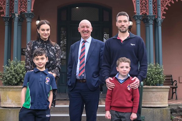 Bill Sweeney (centre) principal of Hume Grammar with school families L-R Faten and Aydin Eren and Simon and Hamish Peryman.