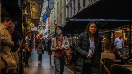Pedestrians walk through Degraves Street on Tuesday following the government announcement.