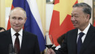 Russian President Vladimir Putin and Vietnamese President To Lam toast during a gala reception after their talks in Hanoi on Thursday.