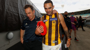 Alastair Clarkson and Shaun Burgoyne leave the MCG for the final time in Hawthorn colours. 