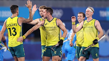 Blake Govers celebrates a goal with his Kookaburras teammates.