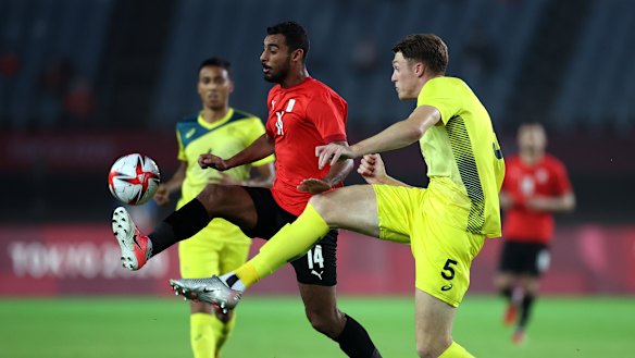 Australia’s beanpole defender Harry Souttar tries to intercept Egypt’s Ahmed Rayan.