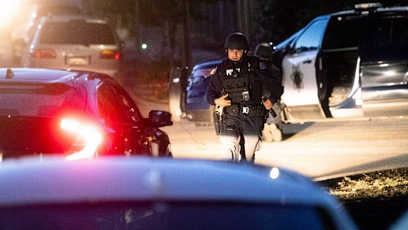 Police work a scene after a deadly shooting at the Gilroy Garlic Festival.