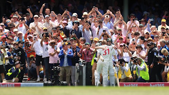 David Warner hugs Steve Smith as he walks off the SCG after being dismissed for a final time in Test cricket.
