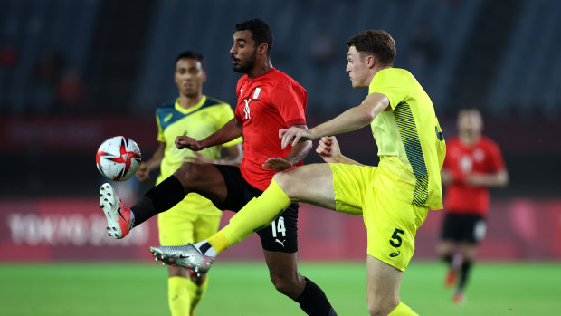 Australia’s beanpole defender Harry Souttar tries to intercept Egypt’s Ahmed Rayan.