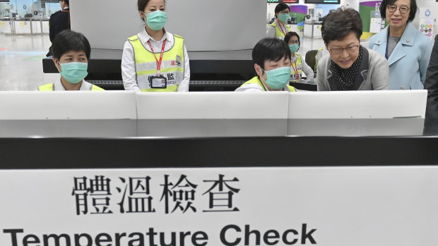 Chief Executive Carrie Lam, second from right, reviews the health surveillance measures at West Kowloon Station in Hong Kong on January 3.