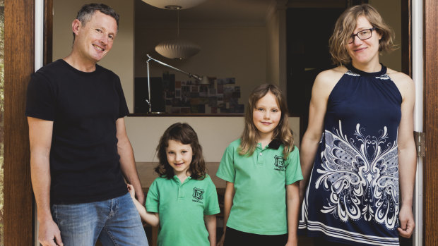 Canberra architect Robbie Gibson has invested into SolarShare, a community run solar farm. Mr Gibson is pictured with his wife Karin Gustavsson, and their children Nelly 6, and Freya 9.