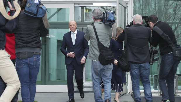 Peter Dutton on the way to a press conference on Thursday.