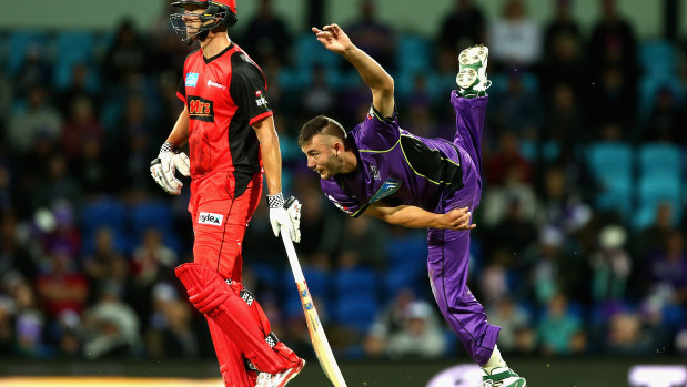 Aaron Summers, right, bowling for the Hobart Hurricanes in 2017. 