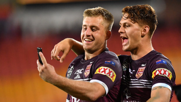 Perfect pair: Cameron Munster and Kalyn Ponga after the Maroons' victory.