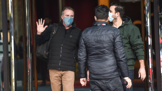 Returned traveller Patrick Enright (left) finishes his two-week hotel quarantine on Tuesday.