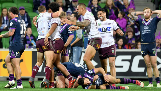 Elation: Manly celebrate on their way to a huge victory over the Storm.