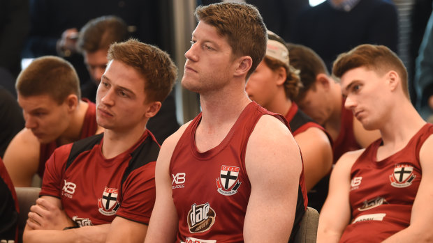Jack Billings, Sam Rowe and Blake Acres watch and listen as coach Alan Richardson steps down.
