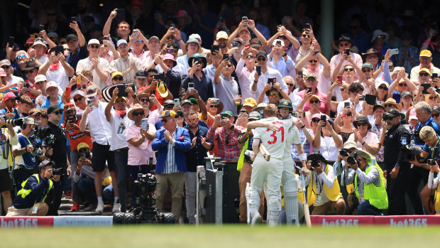 David Warner hugs Steve Smith as he walks off the SCG after being dismissed for a final time in Test cricket.