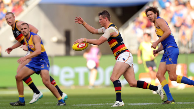 Dogged: Matt Crouch helped keep the Crows in the contest.