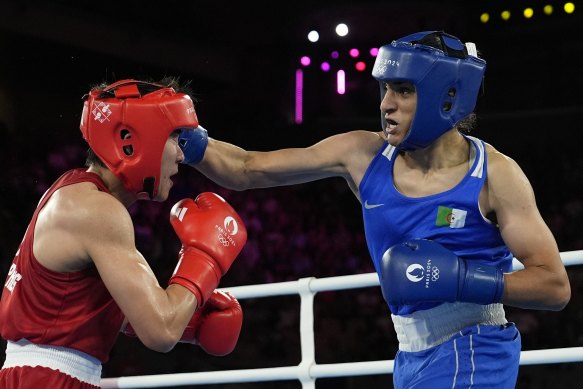 Imane Khelif (right) lands a right hook on Thailand’s Janjaem Suwannapheng.