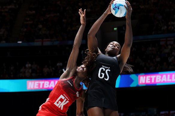 Grace Nweke of Team New Zealand and Jayda Pechova of Team England jump for the ball.